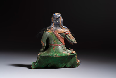 A Chinese gilt and polychrome lacquered papier-m&acirc;ch&eacute; and wooden Guandi on a wooden stand, 19th C.