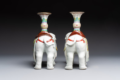 A pair of Chinese famille rose elephants carrying a 'Gu' vase and three sancai-glazed immortals, 20th C.