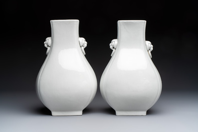 A pair of Chinese white-glazed 'Hu' vases and a Longquan celadon 'Twin Fish' plate, 20th C.