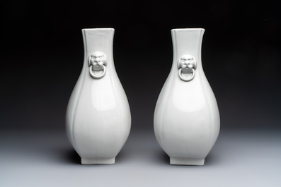 A pair of Chinese white-glazed 'Hu' vases and a Longquan celadon 'Twin Fish' plate, 20th C.