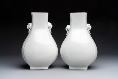 A pair of Chinese white-glazed 'Hu' vases and a Longquan celadon 'Twin Fish' plate, 20th C.
