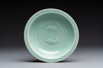 A pair of Chinese white-glazed 'Hu' vases and a Longquan celadon 'Twin Fish' plate, 20th C.