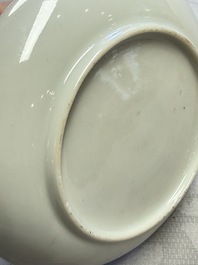 A fine Chinese Canton famille rose cup and saucer with figural design, Yongzheng/Qianlong