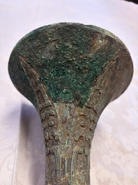 A Chinese archaic bronze wine vessel with Taotie design, Gu 觚, Shang