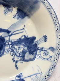 A Chinese blue and white 'Hunting Scene' cup and saucer, Kangxi