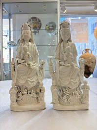 A pair of Chinese Dehua blanc de Chine groups of Guanyin with a child and servants, 18th C.