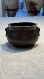 A Chinese bronze censer with lion-head handles and relief dragon design, Lu Gu Zhai 侶古齋 mark, 18/19th C.