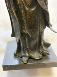 A Chinese bronze standing Guanyin with boy, Ming