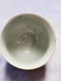 A fine Chinese Canton famille rose cup and saucer with figural design, Yongzheng/Qianlong