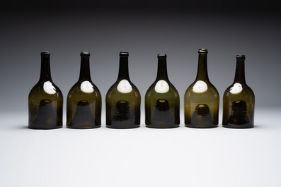 A set of six dark green glass mallet-shaped bottles, possibly France or England, 19th C. or earlier