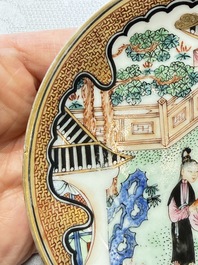 A fine Chinese Canton famille rose cup and saucer with figural design, Yongzheng/Qianlong
