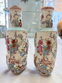 A pair of Chinese famille rose relief-moulded 'Immortals' vases, Qianlong mark, Republic