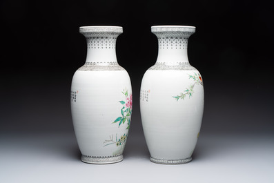 A Chinese famille rose 'Mountainous Landscape' jardiniere with a stand and a pair of vases with floral design, Qianlong marks, 20th C.