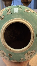 A pair of fine Chinese famille verte turquoise-ground 'Magpie and Prunus' jars with reticulated wooden covers, 19th C.