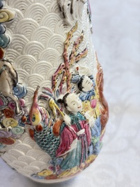 A pair of Chinese famille rose relief-moulded 'Immortals' vases, Qianlong mark, Republic