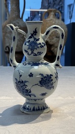 A Chinese blue and white 'Floral' ewer, Transitional period