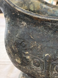 A rare and large Chinese archaistic bronze pouring vessel and cover, Gong 觥, Qing