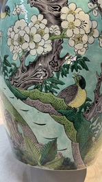 A pair of fine Chinese famille verte turquoise-ground 'Magpie and Prunus' jars with reticulated wooden covers, 19th C.