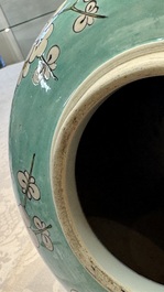 A pair of fine Chinese famille verte turquoise-ground 'Magpie and Prunus' jars with reticulated wooden covers, 19th C.