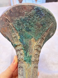 A Chinese archaic bronze wine vessel with Taotie design, Gu 觚, Shang