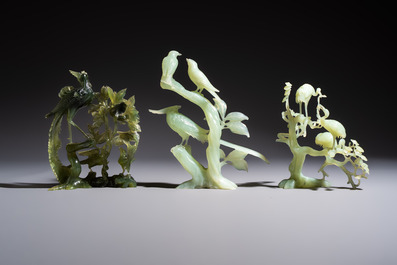 Five Chinese hardstone carvings, four with wooden stands, 20th C.