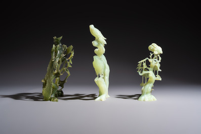 Five Chinese hardstone carvings, four with wooden stands, 20th C.