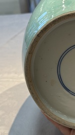 A pair of fine Chinese famille verte turquoise-ground 'Magpie and Prunus' jars with reticulated wooden covers, 19th C.