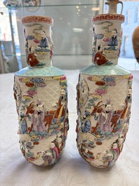 A pair of Chinese famille rose relief-moulded 'Immortals' vases, Qianlong mark, Republic