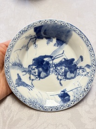 A Chinese blue and white 'Hunting Scene' cup and saucer, Kangxi