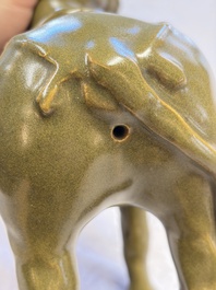 A Chinese teadust-glazed model of a horse on a wooden stand, Republic