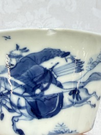 A Chinese blue and white 'Hunting Scene' cup and saucer, Kangxi