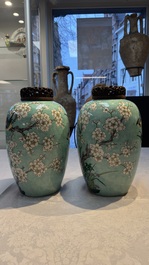 A pair of fine Chinese famille verte turquoise-ground 'Magpie and Prunus' jars with reticulated wooden covers, 19th C.