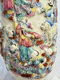 A pair of Chinese famille rose relief-moulded 'Immortals' vases, Qianlong mark, Republic
