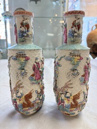 A pair of Chinese famille rose relief-moulded 'Immortals' vases, Qianlong mark, Republic