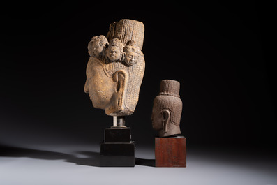 A Khmer-style carved stone head and a carved stone head of a deity, Thailand and Cambodia, 20th C. or earlier