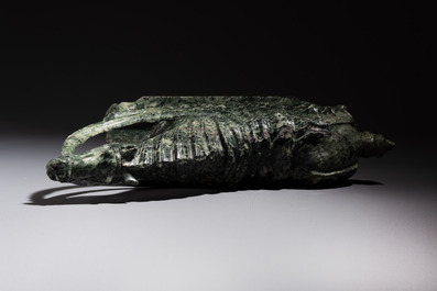 A large Chinese carved serpentine horse on a wooden stand, 20th C.