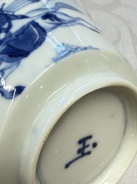 A Chinese blue and white 'Hunting Scene' cup and saucer, Kangxi