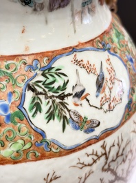 A pair of Chinese famille rose '18 Luohan' vases and covers, 19th C.