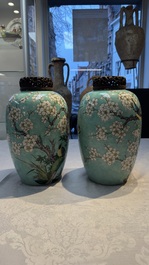 A pair of fine Chinese famille verte turquoise-ground 'Magpie and Prunus' jars with reticulated wooden covers, 19th C.