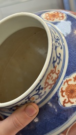 A Chinese blue, white and iron-red decorated 'Mythical Animals' vase and cover, 19th C.