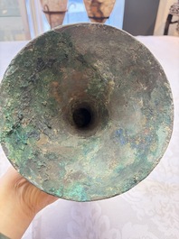 A Chinese archaic bronze wine vessel with Taotie design, Gu 觚, Shang