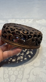 A pair of fine Chinese famille verte turquoise-ground 'Magpie and Prunus' jars with reticulated wooden covers, 19th C.