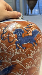 A Chinese blue, white and iron-red decorated 'Mythical Animals' vase and cover, 19th C.