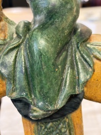 A pair of Chinese sancai-glazed 'Horseriders' roof tiles on wooden stands, Ming