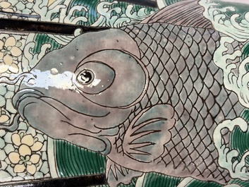 A Chinese verte biscuit 'Dragon Gate Carp 鯉躍龍門' vase on a wooden stand, Xuande mark, 19th C.