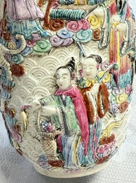 A pair of Chinese famille rose relief-moulded 'Immortals' vases, Qianlong mark, Republic