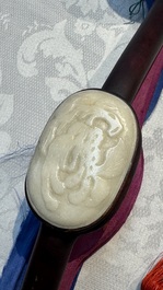 A Chinese white-jade-inset hongmu ruyi with a wooden presentation box and display case, 19th C.