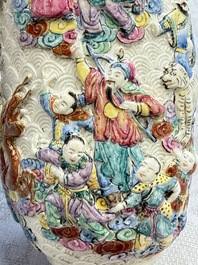 A pair of Chinese famille rose relief-moulded 'Immortals' vases, Qianlong mark, Republic