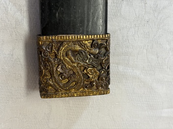 A Chinese palace guard sword 'Dao' inscribed 'Da Nei Shi Wei 大內侍衛', with lacquered wooden scabbard and gilt-bronze 'Dragon' mounts, Qing