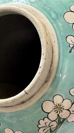 A pair of fine Chinese famille verte turquoise-ground 'Magpie and Prunus' jars with reticulated wooden covers, 19th C.